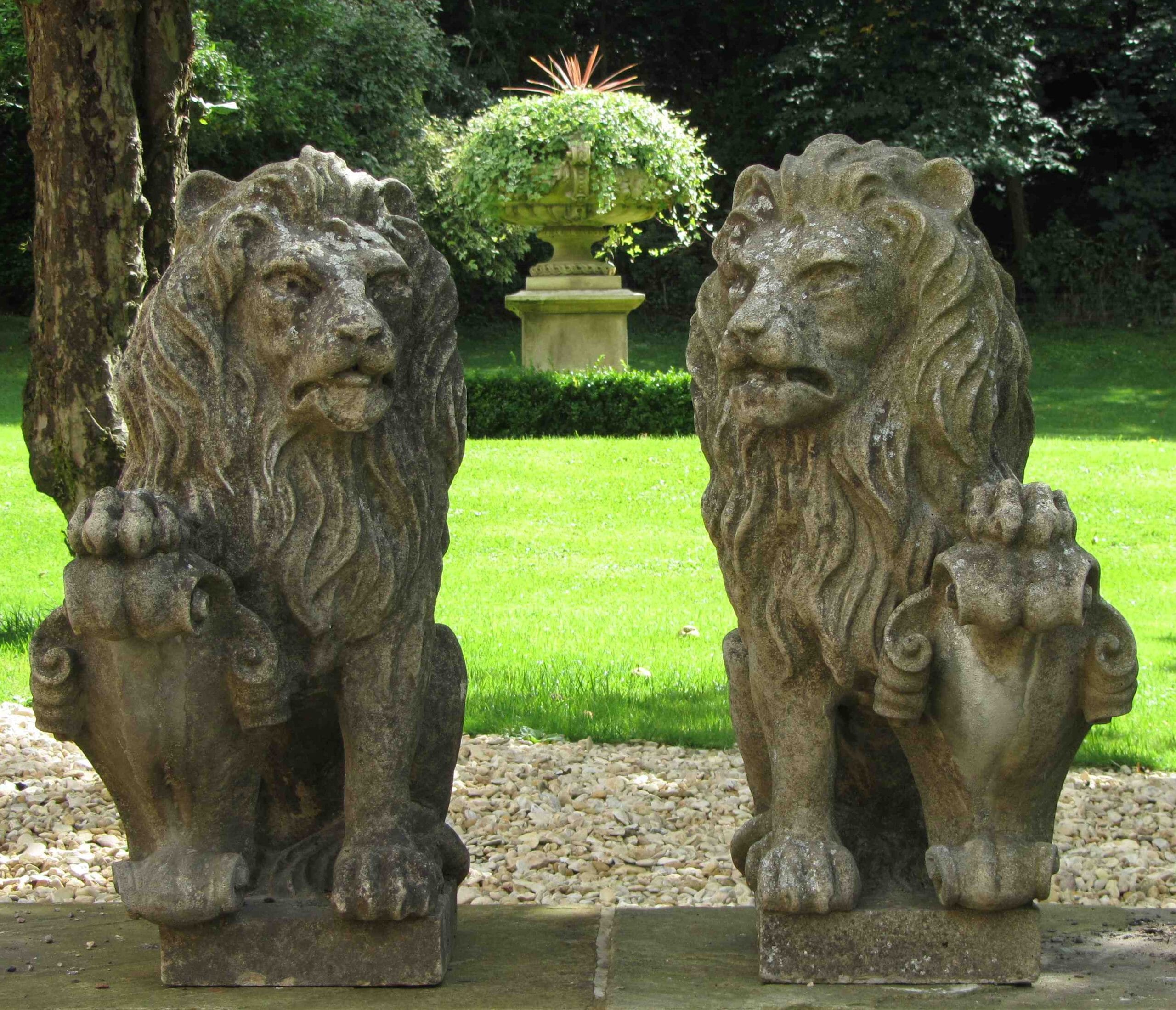 pair-of-original-garden-antique-stone-lions-on-steps-in-an english-garden